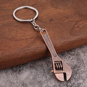 Mini vintage bronze metal wrench keychain with realistic adjustable industrial style details