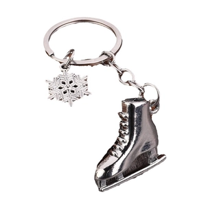 Silver ice skate keychain with snowflake pendant made of polished metal for winter gifts