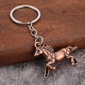 Vintage bronze alloy horse keychain featuring a galloping stallion with intricate muscle detail