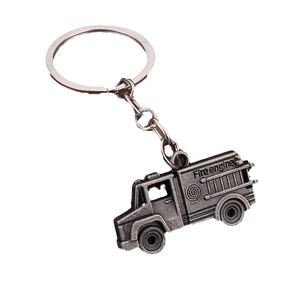 Retro zinc alloy fire engine keychain in antique silver finish on white background