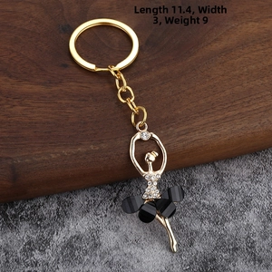 Detailed view of ballet dancer keychain with crystals, black dress, 11.4cm length