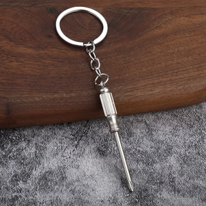 Close-up of a 3D mini silver Phillips screwdriver keychain made of polished alloy