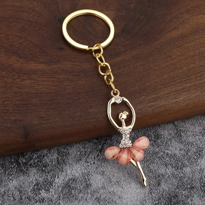 Golden ballet dancer keychain with pink crystal petals and sparkling rhinestones