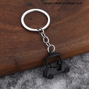 Detail of 3D golf cart keychain in matte black alloy showing roof and steering wheel