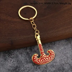 Ethnic style golden alloy keychain with red enamel patterns, size 5x3.7cm and weight 8g