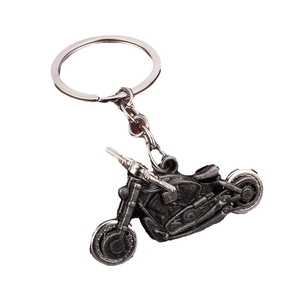 Retro industrial style motorcycle keychain with movable wheels in antique silver finish