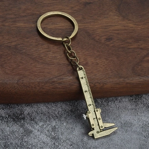Mini vernier caliper keychain made of bronze metal with movable ruler and scale