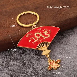 Golden dragon embossed fan keychain with red enamel and Chinese knot pendant