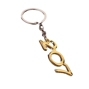Polished gold 2021 number keychain with silver metal ring and chain on white background