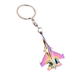 Fighter jet airplane keychain with iridescent metallic gradient finish on white background