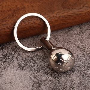 Miniature manual car gear shifter keychain in silver polished metal with detailed gear map