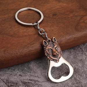 Detailed view of a vintage bronze wolf head keychain with built-in metal bottle opener
