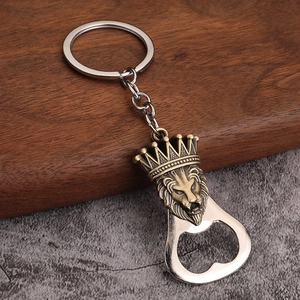 Detailed close-up of a vintage lion head bottle opener keychain with crown relief design
