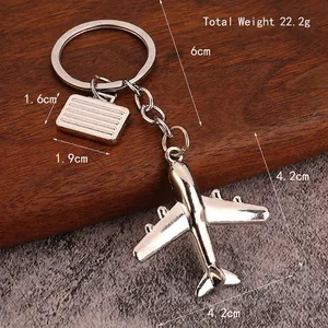 Silver 3D airplane keychain with suitcase pendant and precise dimensions for gift