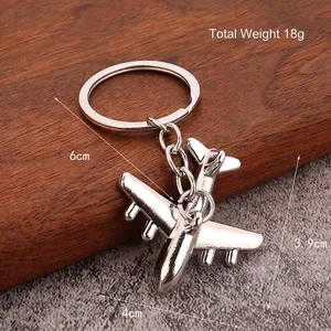 Polished silver metal airplane keychain model with detailed 18g weight and 6cm dimensions
