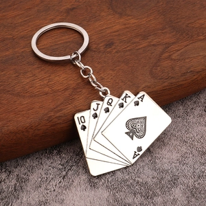 Silver alloy keychain featuring a royal flush poker hand on a textured wood and stone background