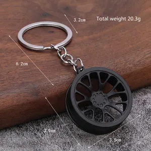 Creative matte black car wheel rim keychain with silver ring for automotive enthusiasts