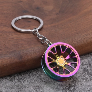 Rainbow gradient metal alloy car wheel rim keychain with a multi-spoke creative design