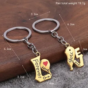Golden heart-shaped couple keychains with Forever Love engraving for gift
