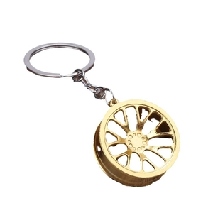 Creative gold car wheel rim keychain with multi-spoke alloy design and silver ring
