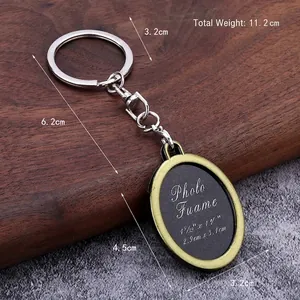 Vintage bronze oval photo frame keychain made of zinc alloy on a rustic wood background