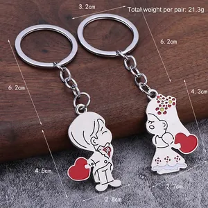 Matching couple keychain with cartoon characters and red heart in silver metal finish