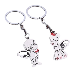 Couples keychain set with white alloy angel figures and red heart details