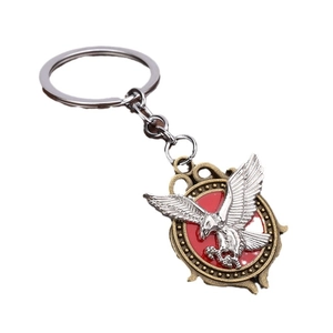 Retro eagle pendant keychain with silver wings on red background and antique bronze frame