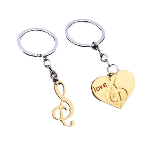 Golden musical note and heart couple keychain set with red love lettering in zinc alloy