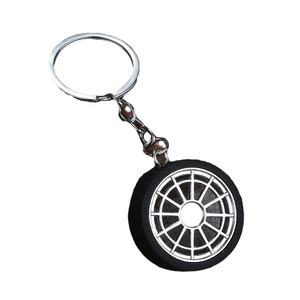 Creative car tire keychain with silver multi-spoke wheel hub and black rubber tire