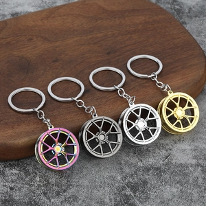 Car rim metal keychains in multicolor, gun grey, silver, and gold finishes