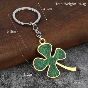 Glitter green four leaf clover metal keychain with silver ring, weighs 14.3g