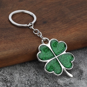 Lucky four leaf clover keychain with sparkling green glitter and silver metal ring