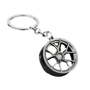 Silver metallic car wheel rim keychain with industrial five-spoke Y-shape design