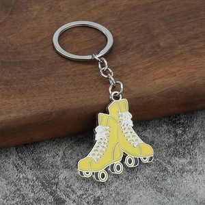 Orange roller skate keychain in zinc alloy with realistic wheel and lace detailing