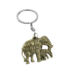 Antique bronze elephant keychain with I Love Thailand engraving on white background