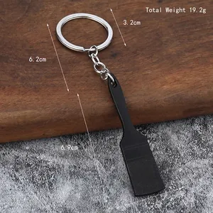 Creative brush shaped metal keychain with 19.2g weight and textured black finish