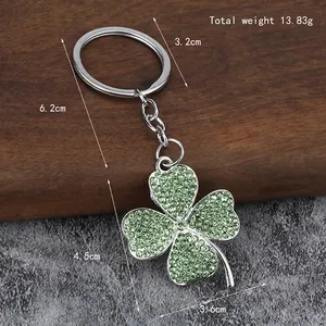 Lucky four-leaf clover keychain with green rhinestones and silver metal ring