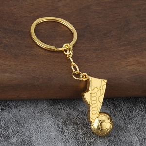 Porte-clés rotatif football doré avec pendentif chaussure de sport et ballon texturé