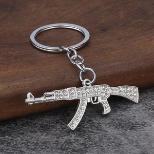 Hip hop AK-47 keychain pendant with sparkling white rhinestones on silver metal
