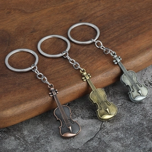 Vintage metal violin keychain set in bronze, gold, and silver finishes for music lovers