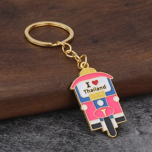 Detailed close-up of a colorful Thai Tuk Tuk taxi keychain with I Love Thailand text