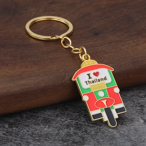 Detail of Thailand Tuk-Tuk taxi keychain with colorful drip oil finish and golden ring