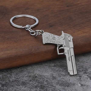 Silver Desert Eagle pistol model keychain made of zinc alloy with realistic metal details