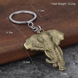 Vintage bronze elephant keychain made of alloy with detailed retro carving and measurements