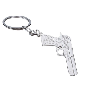 Polished silver Desert Eagle pistol keychain made of durable zinc alloy on white background