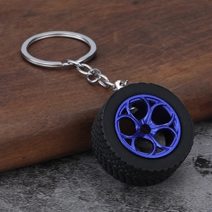 Car tire keychain with black rubber tread and electroplated blue five-spoke wheel hub