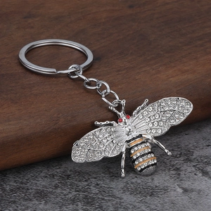 Exquisite silver crystal bee keychain with sparkling rhinestones and red gem accents