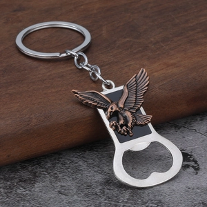 Macro detail of antique bronze eagle keychain with integrated steel bottle opener