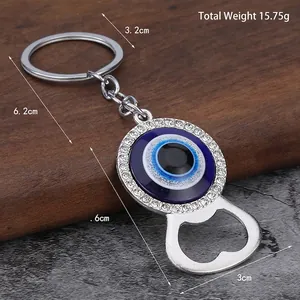 Silver Evil Eye bottle opener keychain with blue crystals and sparkling rhinestones